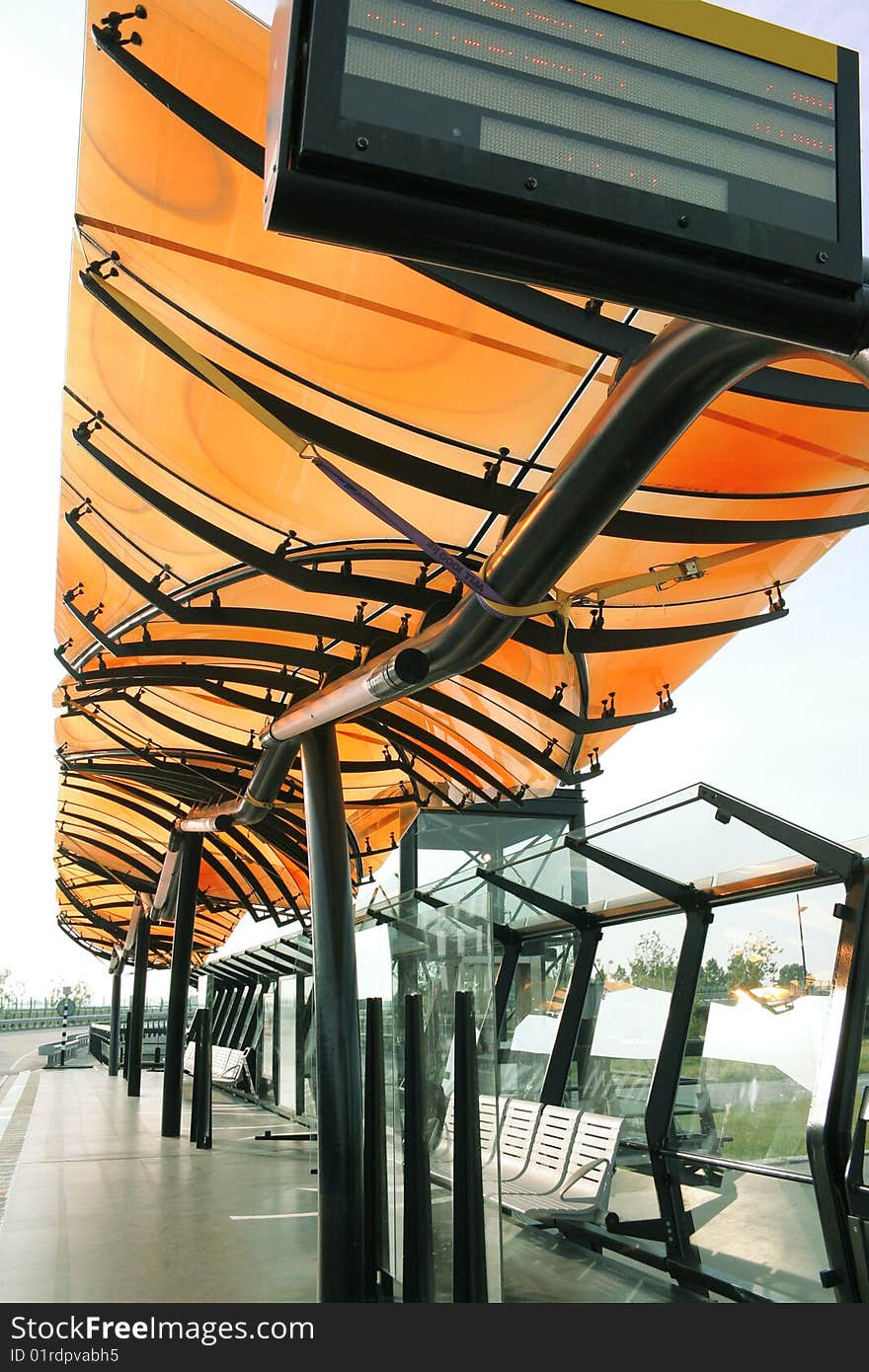 Bright colored bus stop in sunlight. Bright colored bus stop in sunlight