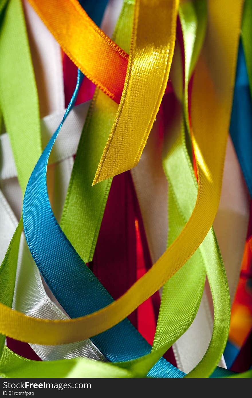 Overlapping strips of synthetic satin. Overlapping strips of synthetic satin.