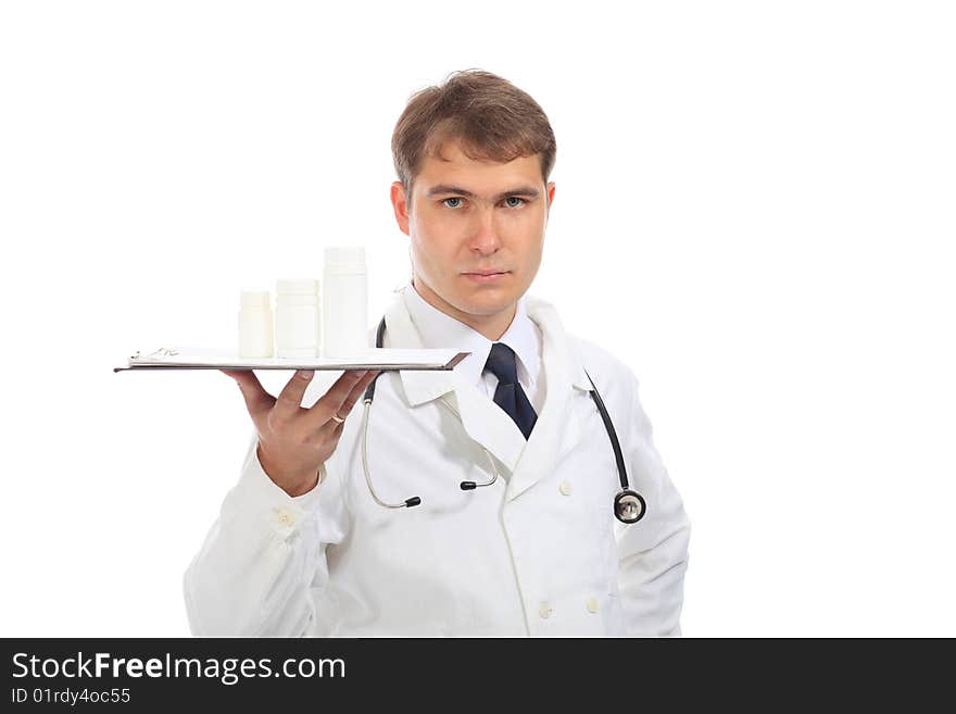 Medical theme: serious doctor holding pills.