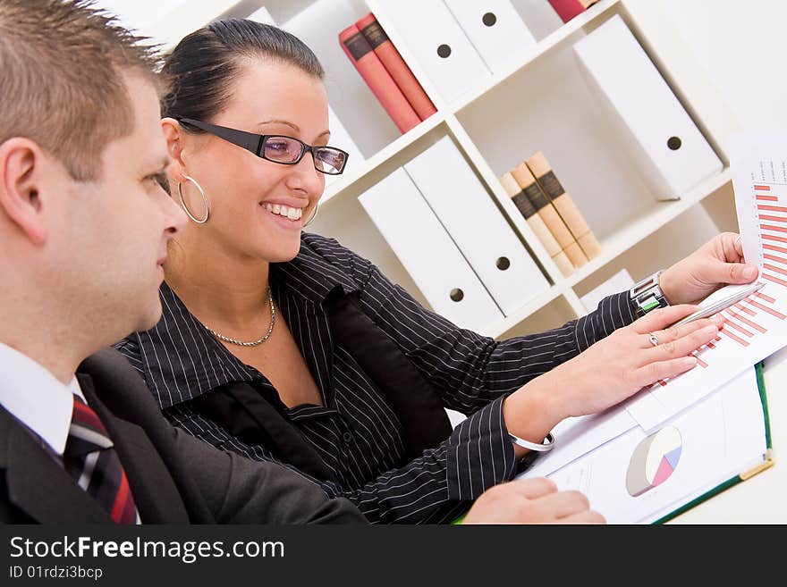 Business man and business woman working in office