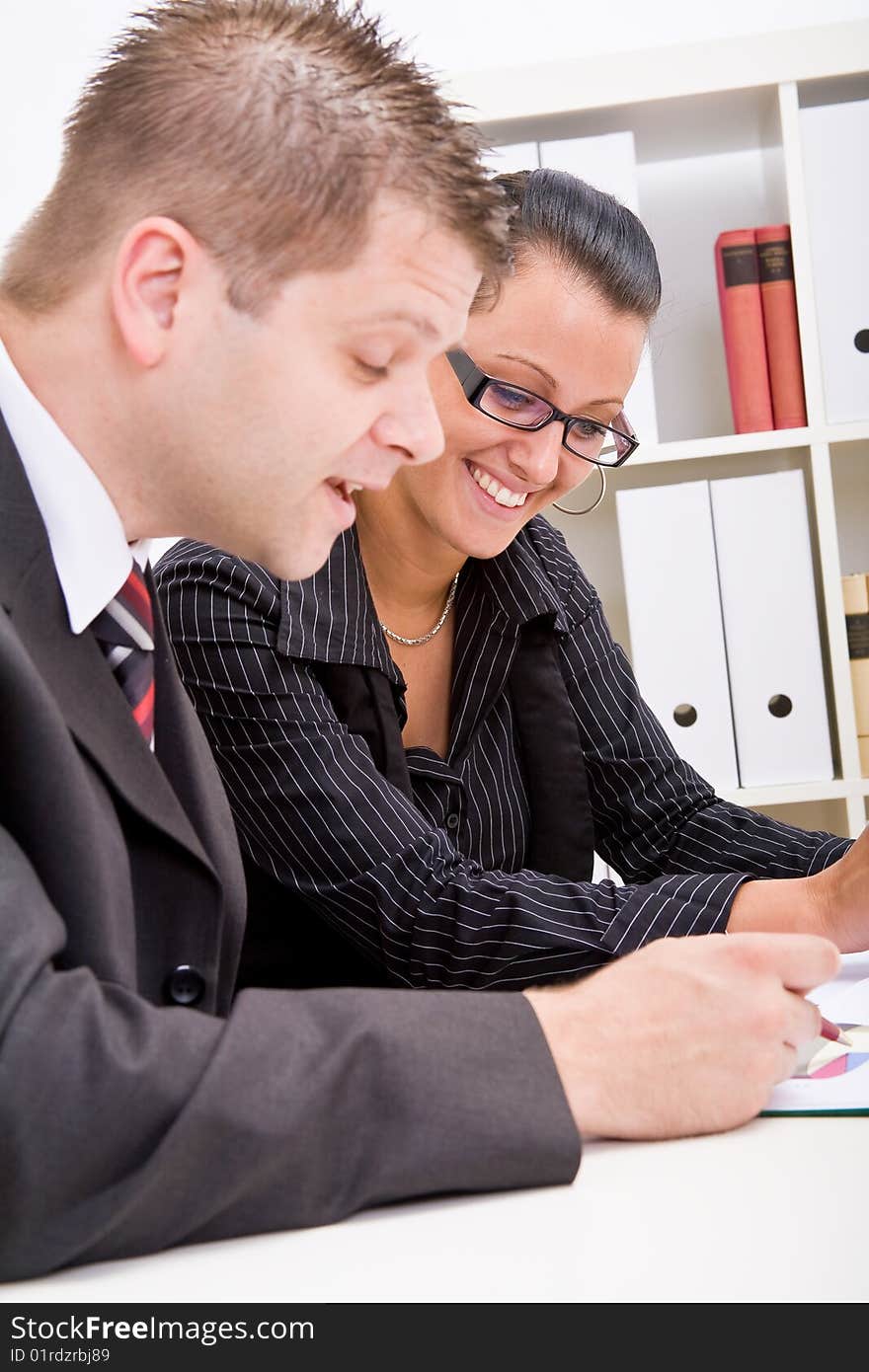 Business man and business woman working in office