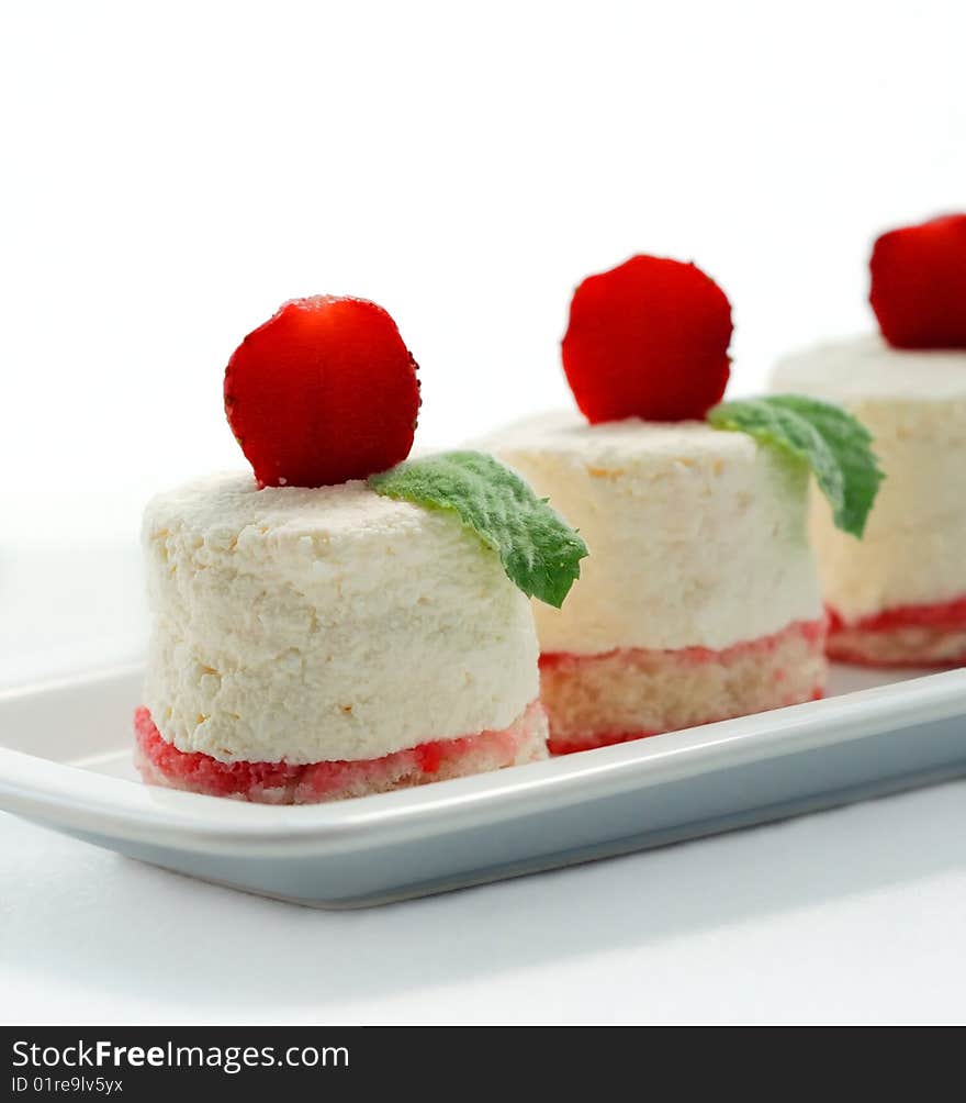 Curd Tenderness On Air Biscuits With A Strawberry