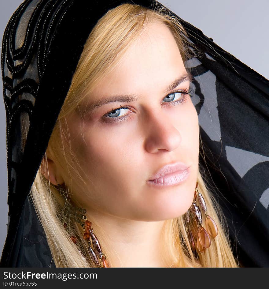 Beautiful blondy with black scarf posing, studio shot