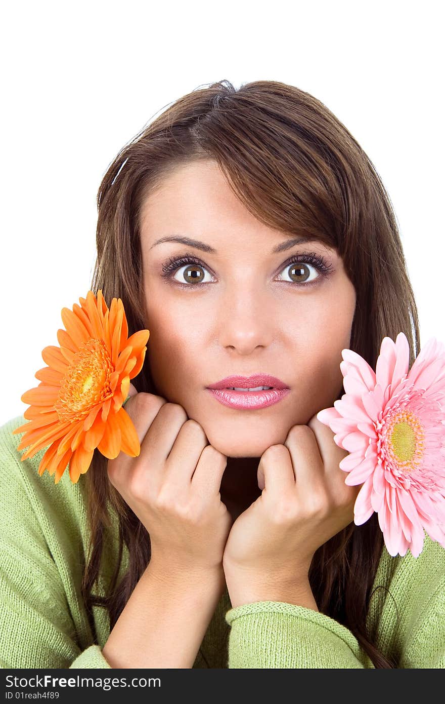 Close-up of beautiful woman with flower, studio shot