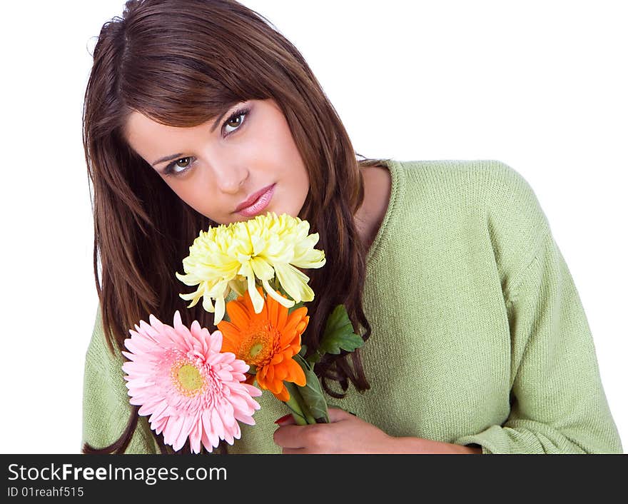 Close-up of beautiful woman with flower, studio shot