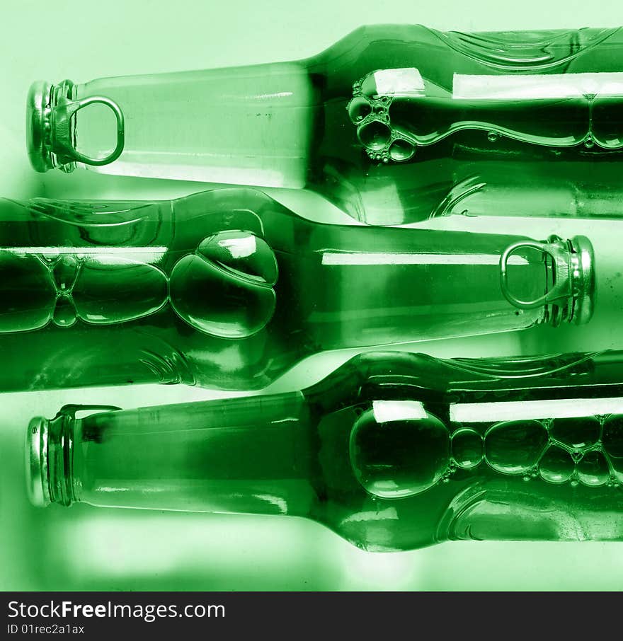 Three bottles of beer in green color