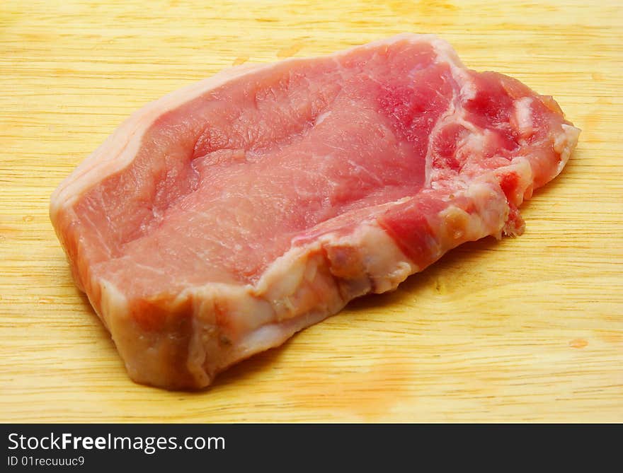 Meat piece on a chopping board