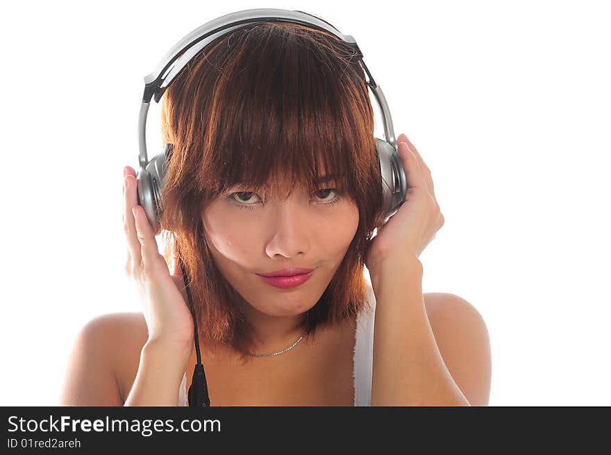 Young asian woman listening music