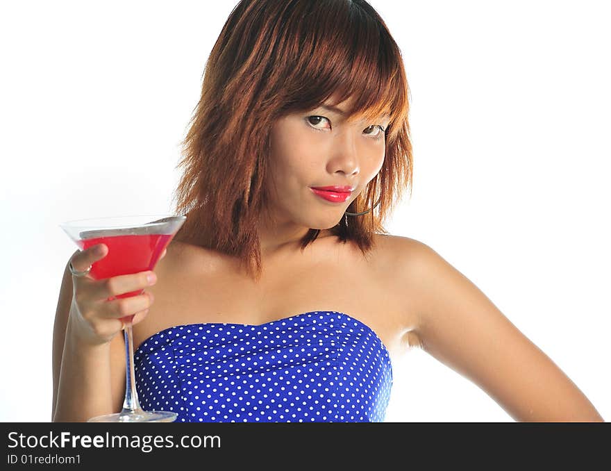 Young asian woman holding a glass of cocktail