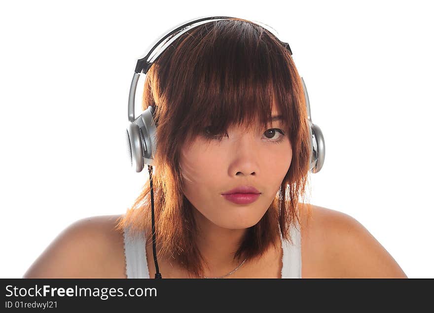 Very seductive young asian woman listening music with headphone