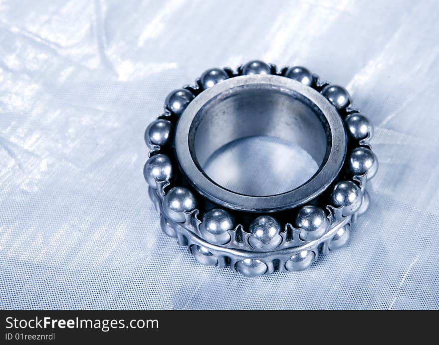 Ball bearing on silver background. Ball bearing on silver background