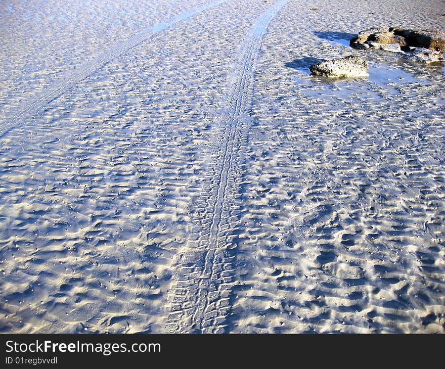 Tyre tracks in the sand on the beach at Gantheaume Point Broome Western Australia. Tyre tracks in the sand on the beach at Gantheaume Point Broome Western Australia