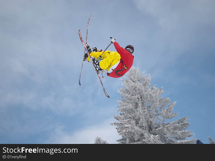 Skier is doing a super hard trick. Skier is doing a super hard trick