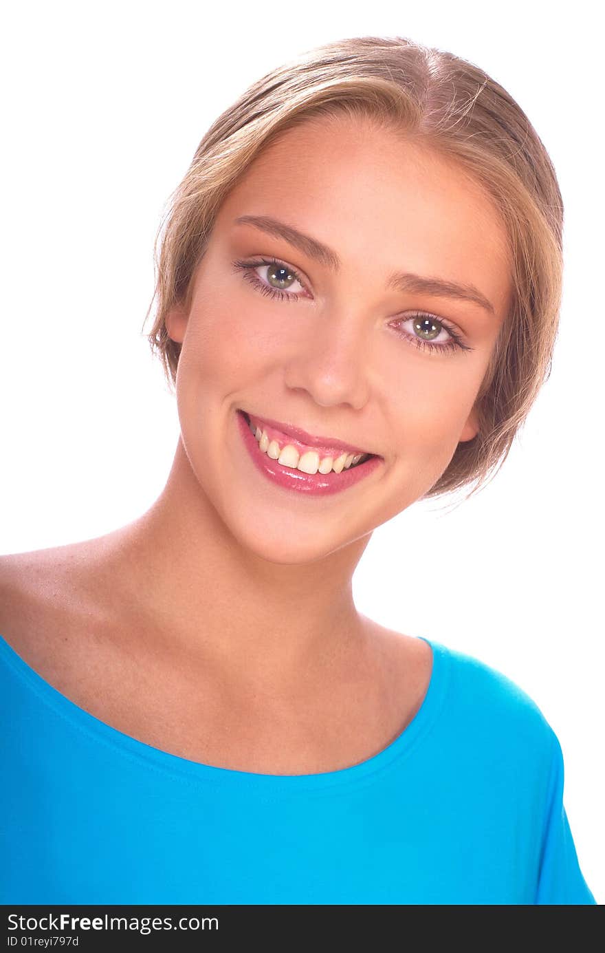 Portrait of a beautiful young blonde in a blue jacket on a light background. Portrait of a beautiful young blonde in a blue jacket on a light background