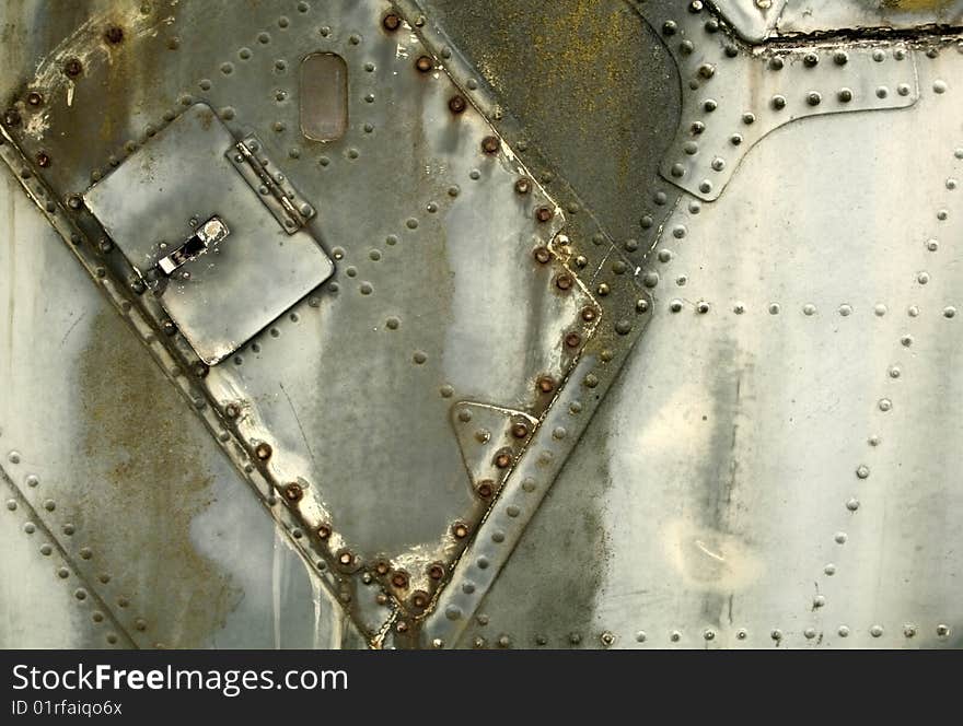 Part of an old war plane panel as a background. Part of an old war plane panel as a background.