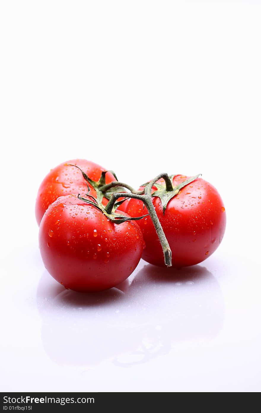 Red tomatoes on white background