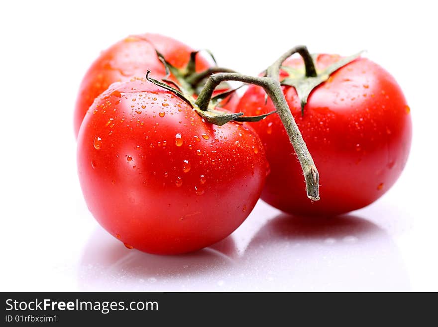 Red tomatoes on white background