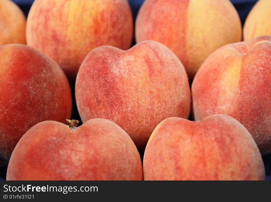 Fresh fuzzy jersey peaches ripe for eating. Fresh fuzzy jersey peaches ripe for eating