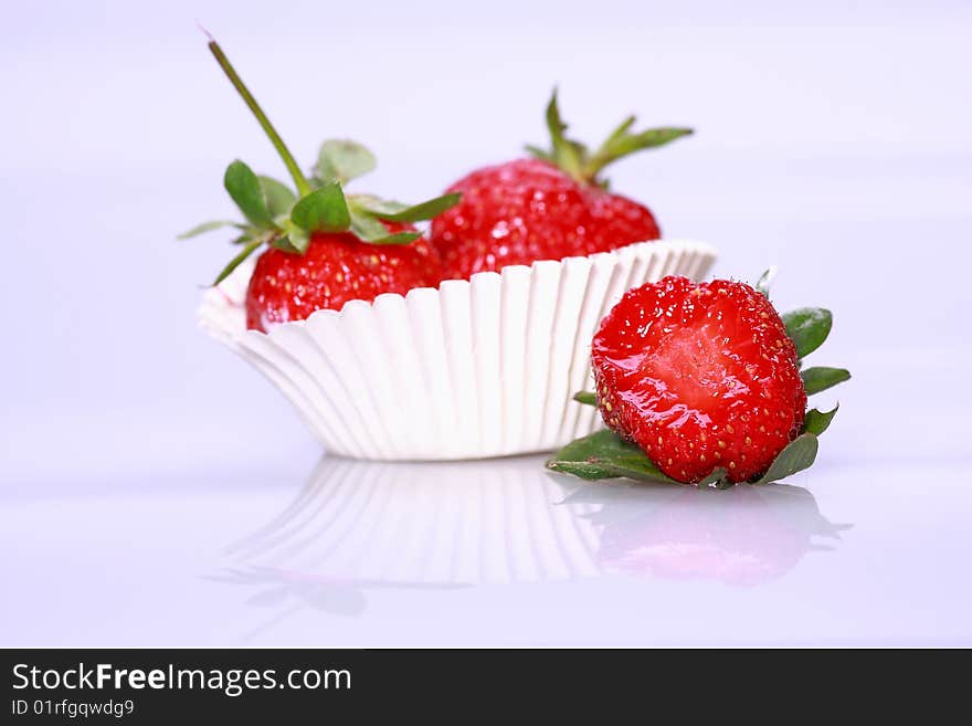 Fresh strawberry with a big bite missing. Fresh strawberry with a big bite missing