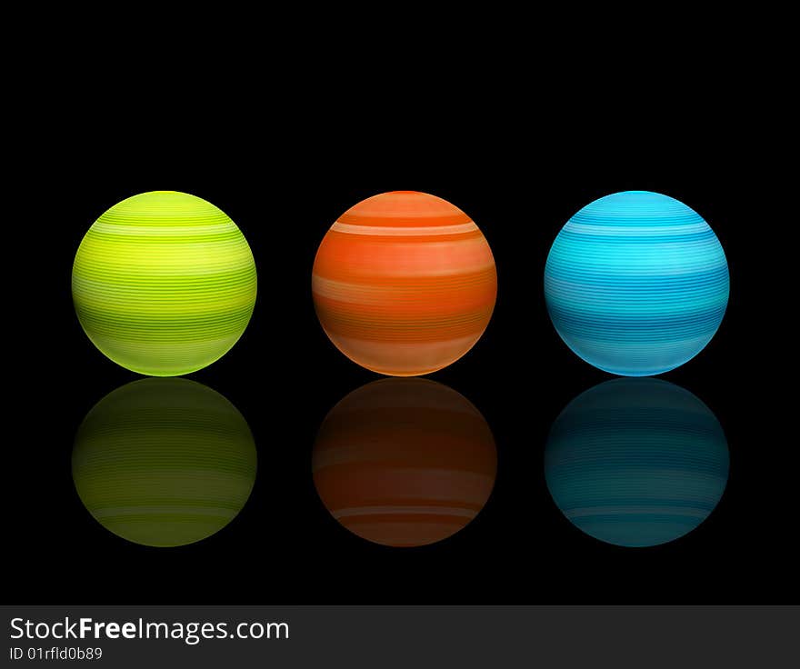 Green, orange and blue spheres with reflection over black background. Green, orange and blue spheres with reflection over black background