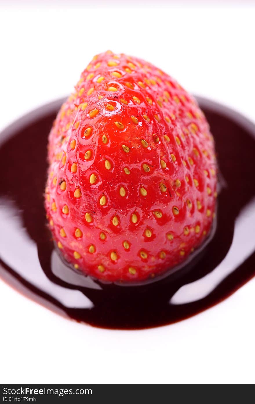 Strawberry in chocolate on white background