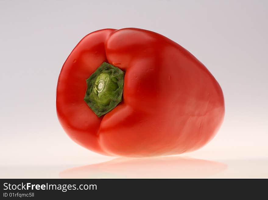 Close-up of fresh red pepper on white background. Close-up of fresh red pepper on white background