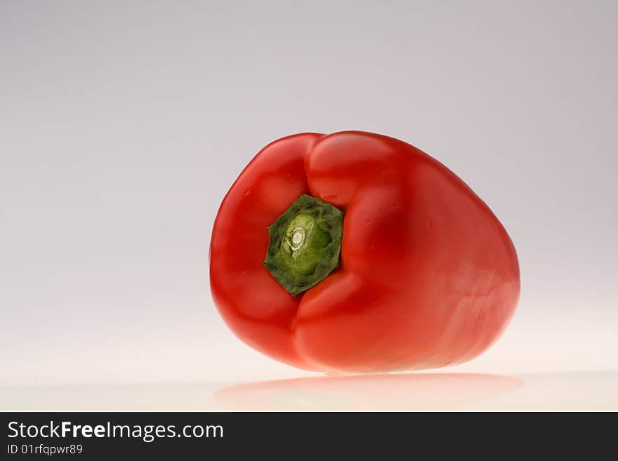 Close-up of fresh red pepper on white background. Close-up of fresh red pepper on white background