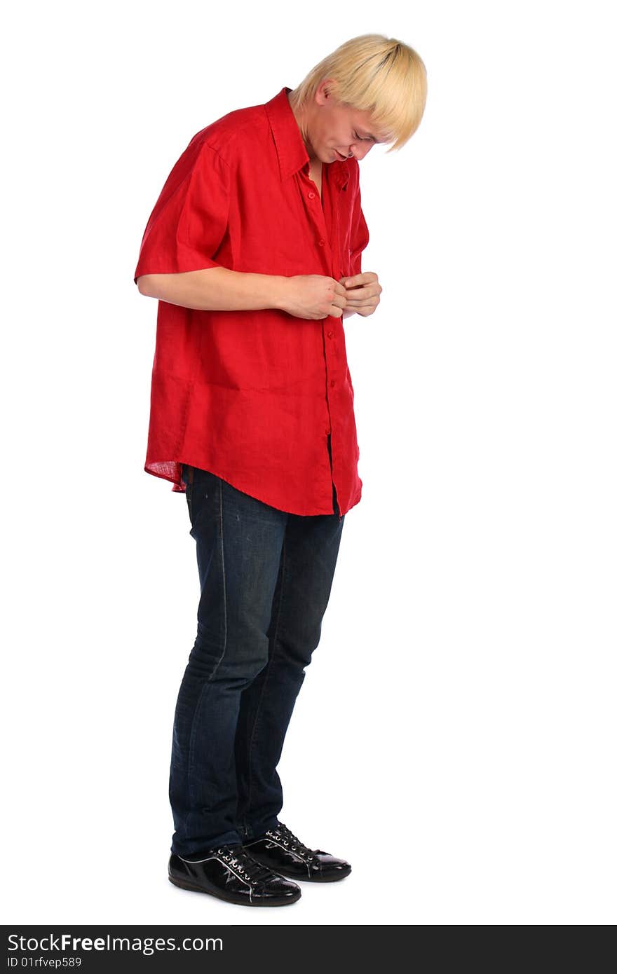 Young blonde man in red shirt posing. Isolated.