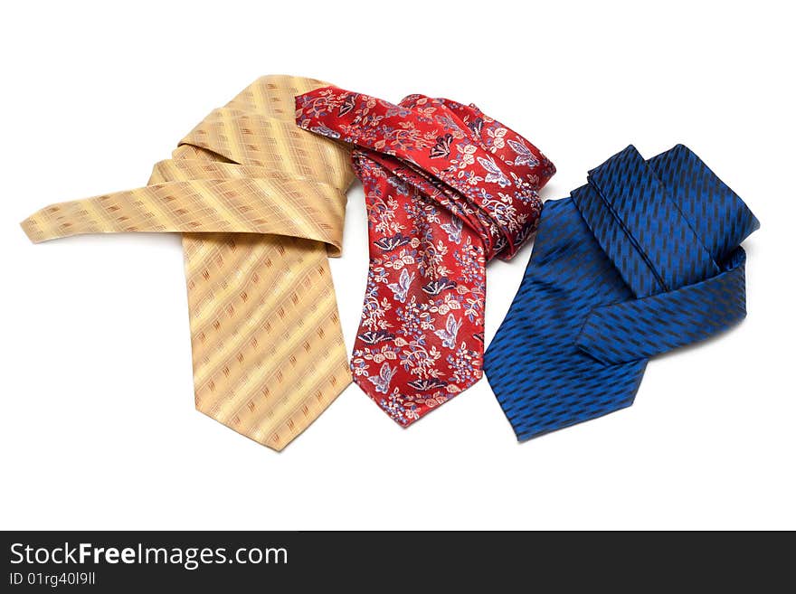 Three ties convolute and rest upon white background