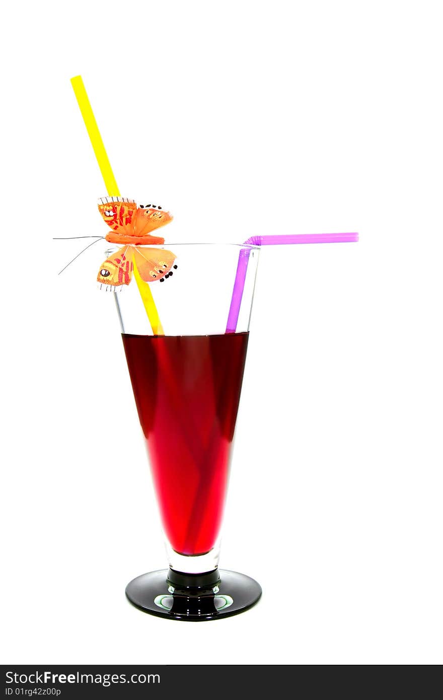 Red cocktail in glass with two straws