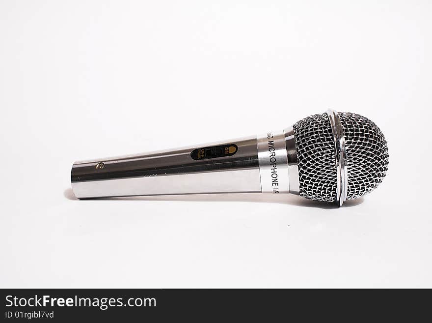 Microphone close-up. Isolated on a white background. Microphone close-up. Isolated on a white background.