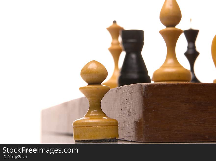 Chessmen on a chessboard, white background