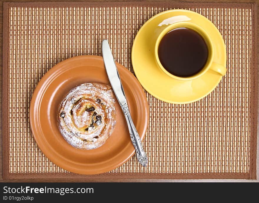 Sweet bun and  tea cup