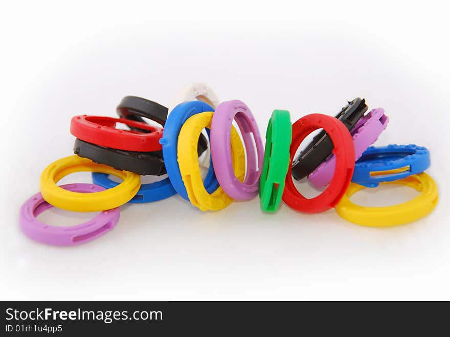 Key protectors of rubber in different colors on a white background. Key protectors of rubber in different colors on a white background