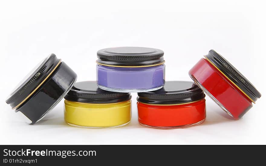 Five paint bottles of glass on a white background. Five paint bottles of glass on a white background