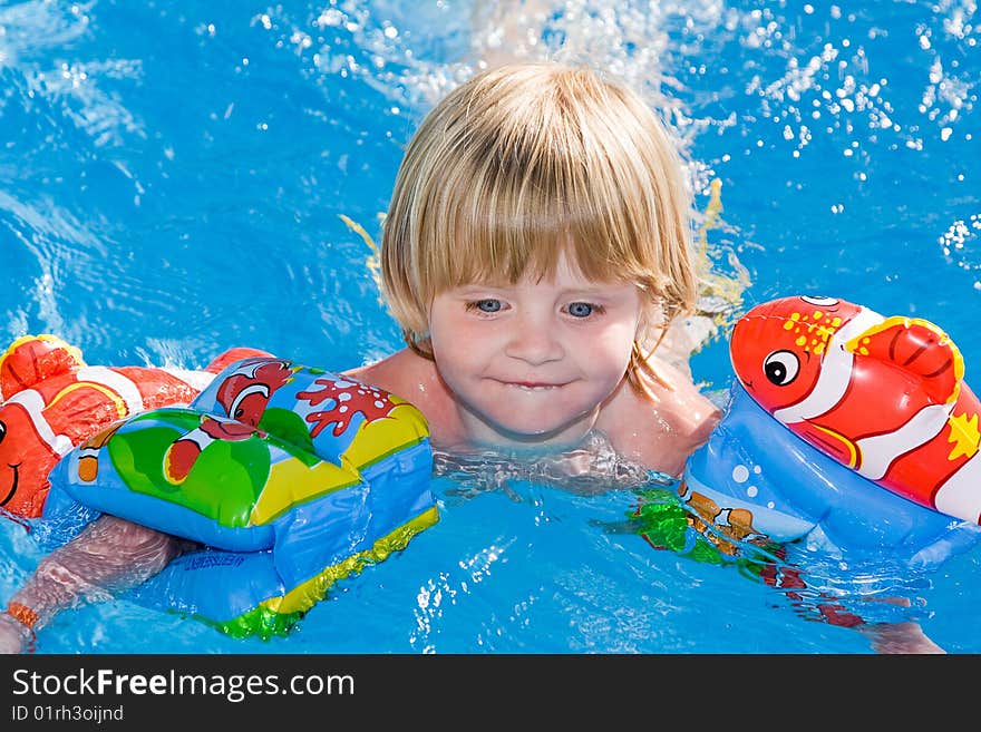 Little girl in the swimming pool