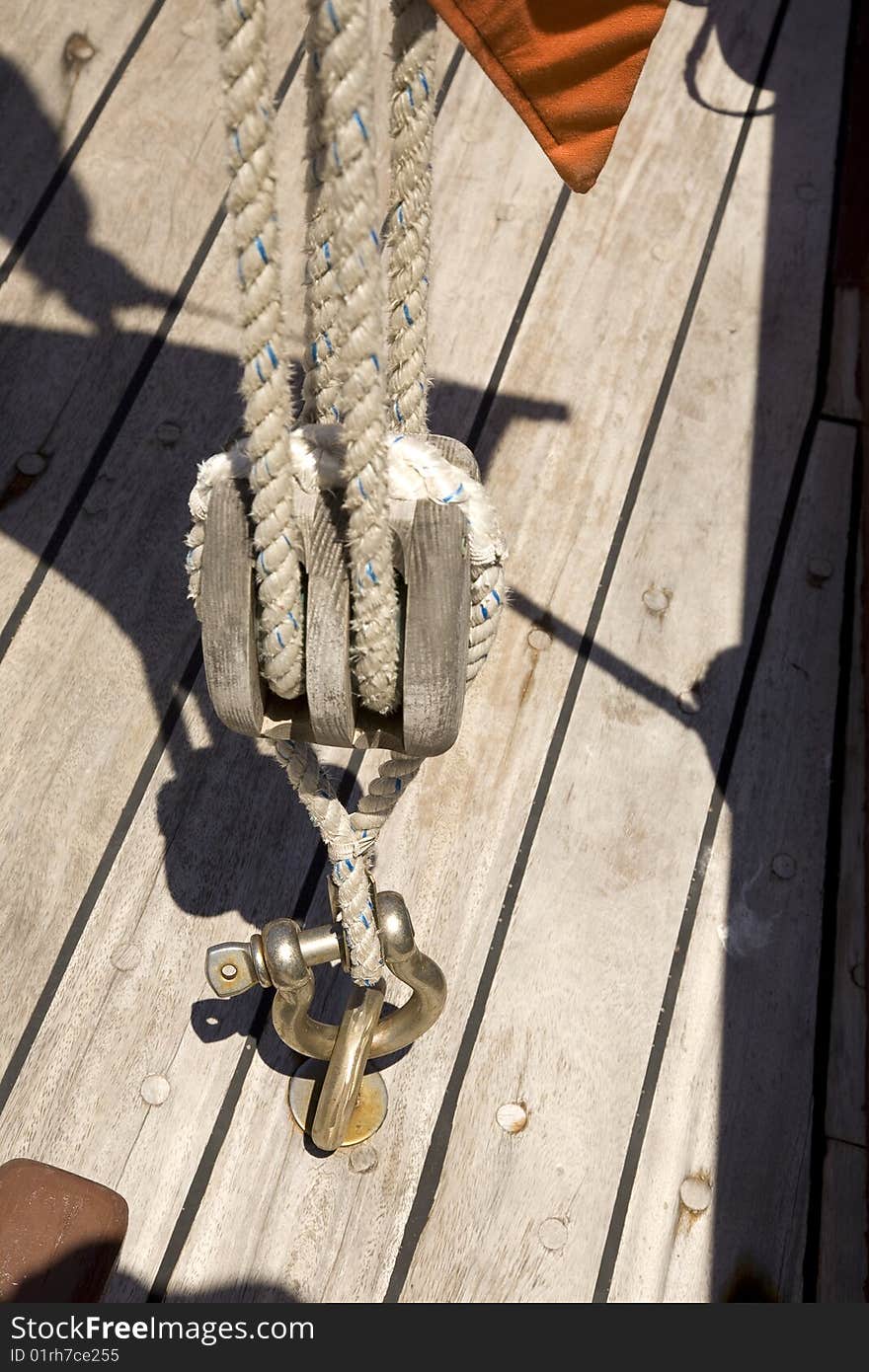 Rigging set. Knots, sheaves, pulleys, swivels, shackles, thimbles, strings and cables, in a vintage wooden sailing ship. Rigging set. Knots, sheaves, pulleys, swivels, shackles, thimbles, strings and cables, in a vintage wooden sailing ship