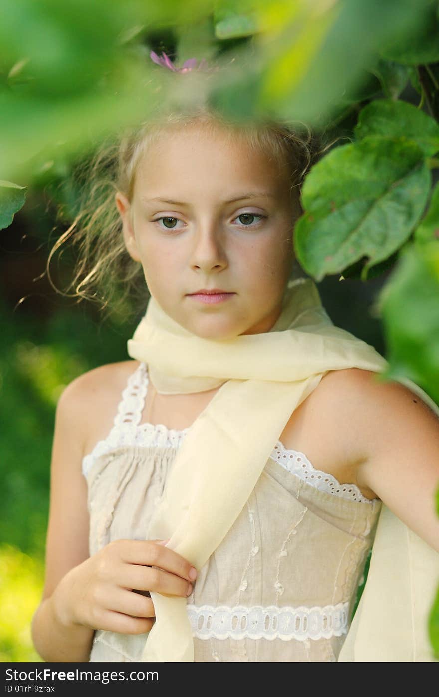 Portrait of the girl in a beautiful dress, on a  background solar wood. Portrait of the girl in a beautiful dress, on a  background solar wood