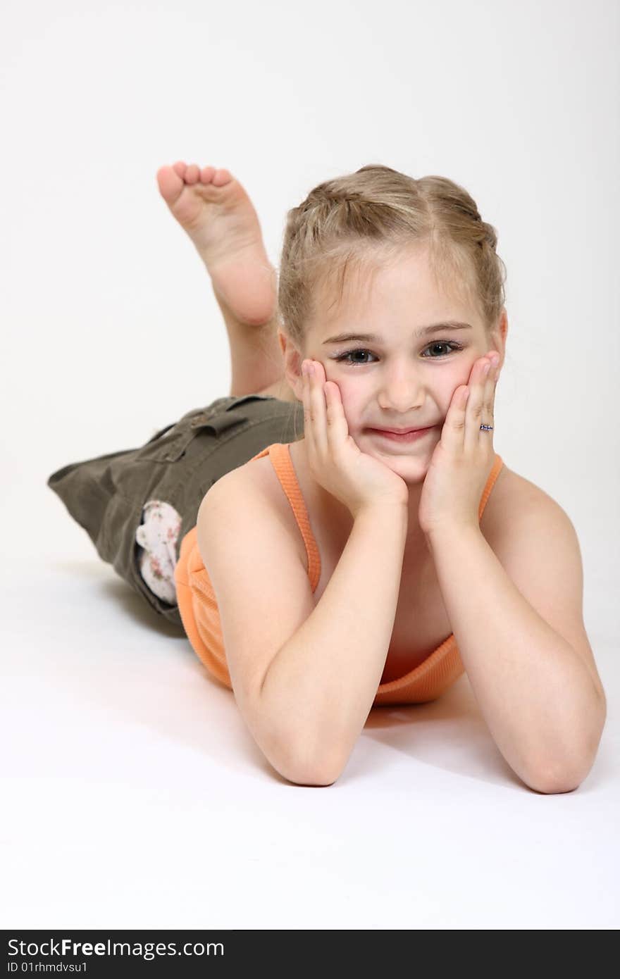 Six years old girl lying on the floor. Six years old girl lying on the floor