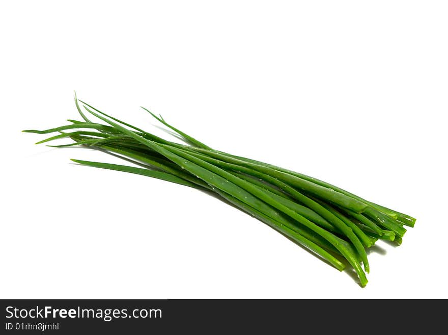 A bunch of green onions (sometimes called shallots or scallions), isolated on white.