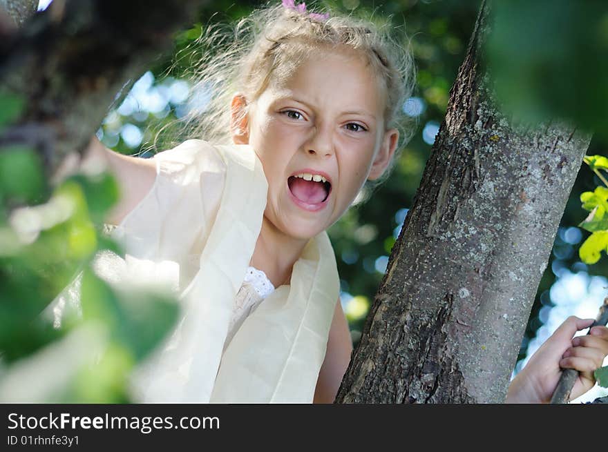 The girl shouts in wood