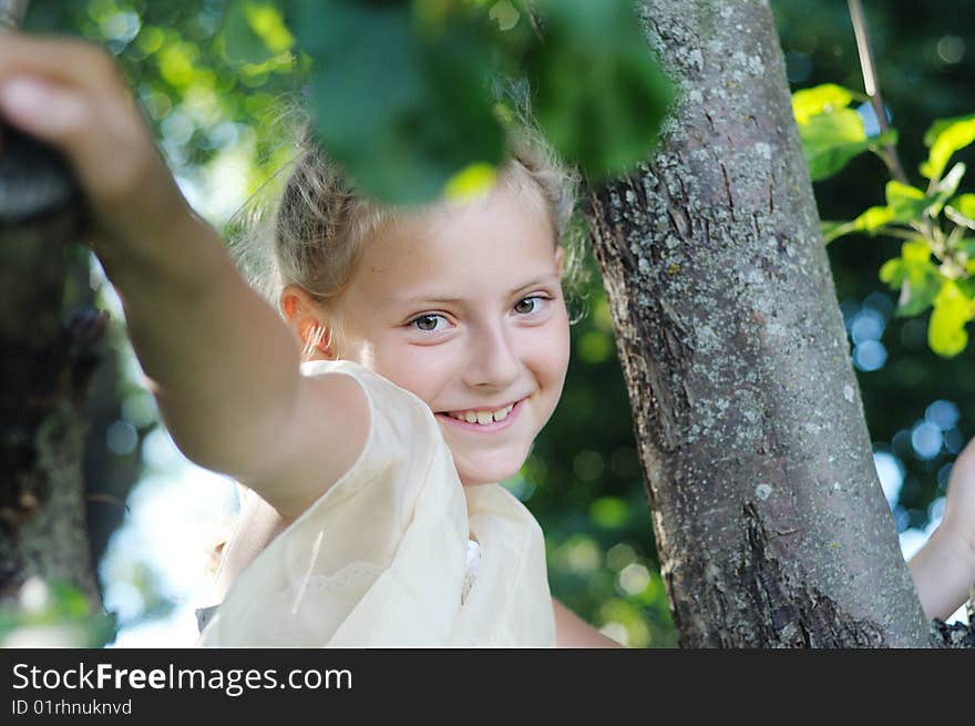 The cute girl among trees