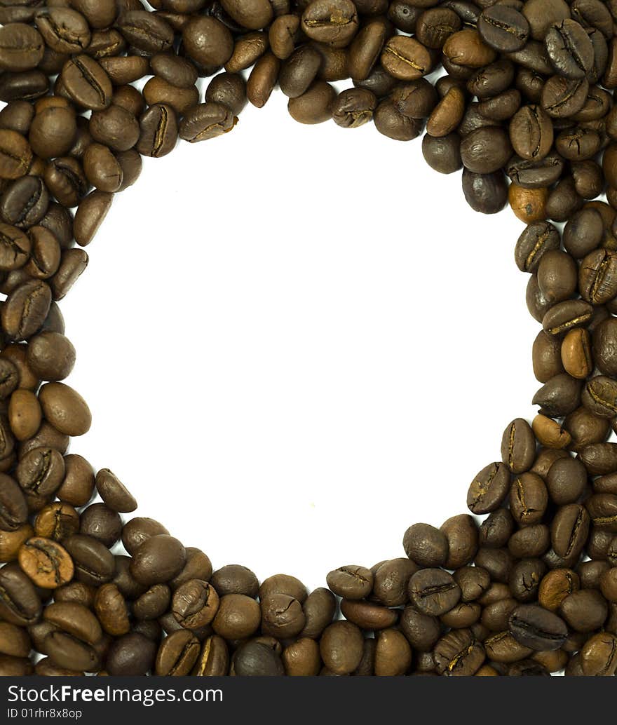 Round frame made of coffee beans white in the midle