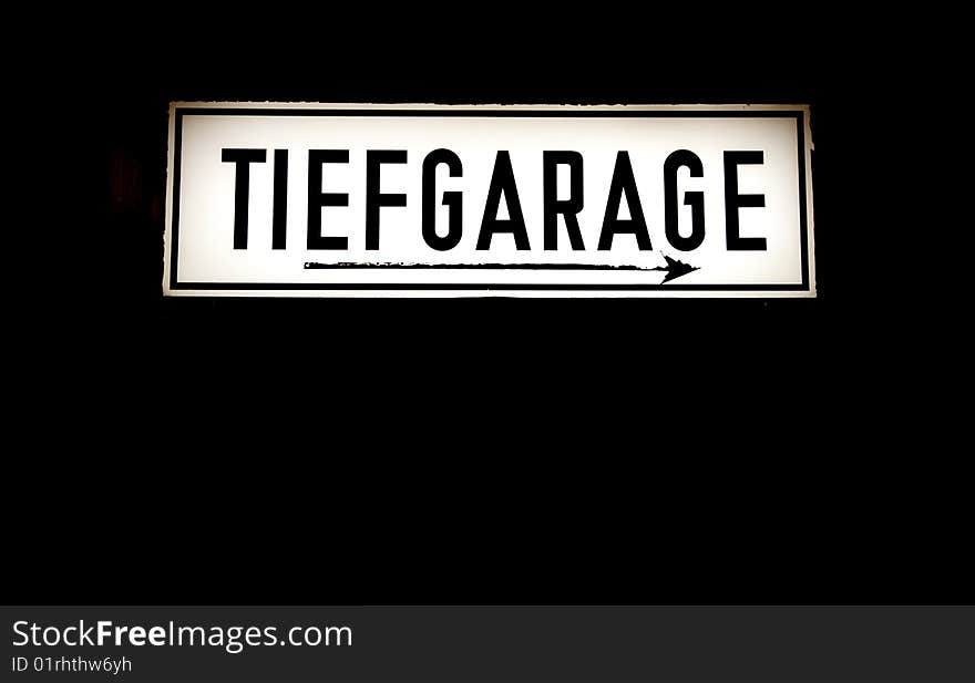 An old sign with the words Tiefgarage German for underground parking garage. An old sign with the words Tiefgarage German for underground parking garage