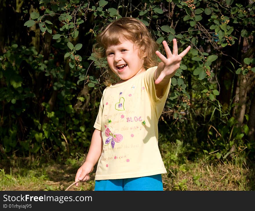 Smiling little girl in the garden. Smiling little girl in the garden