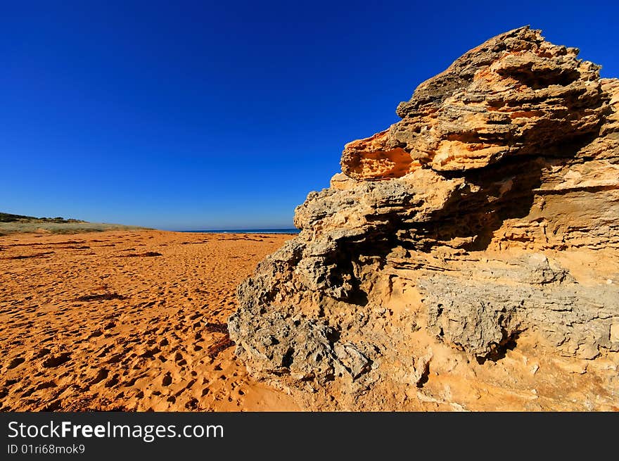 Beach with footprints and rocks