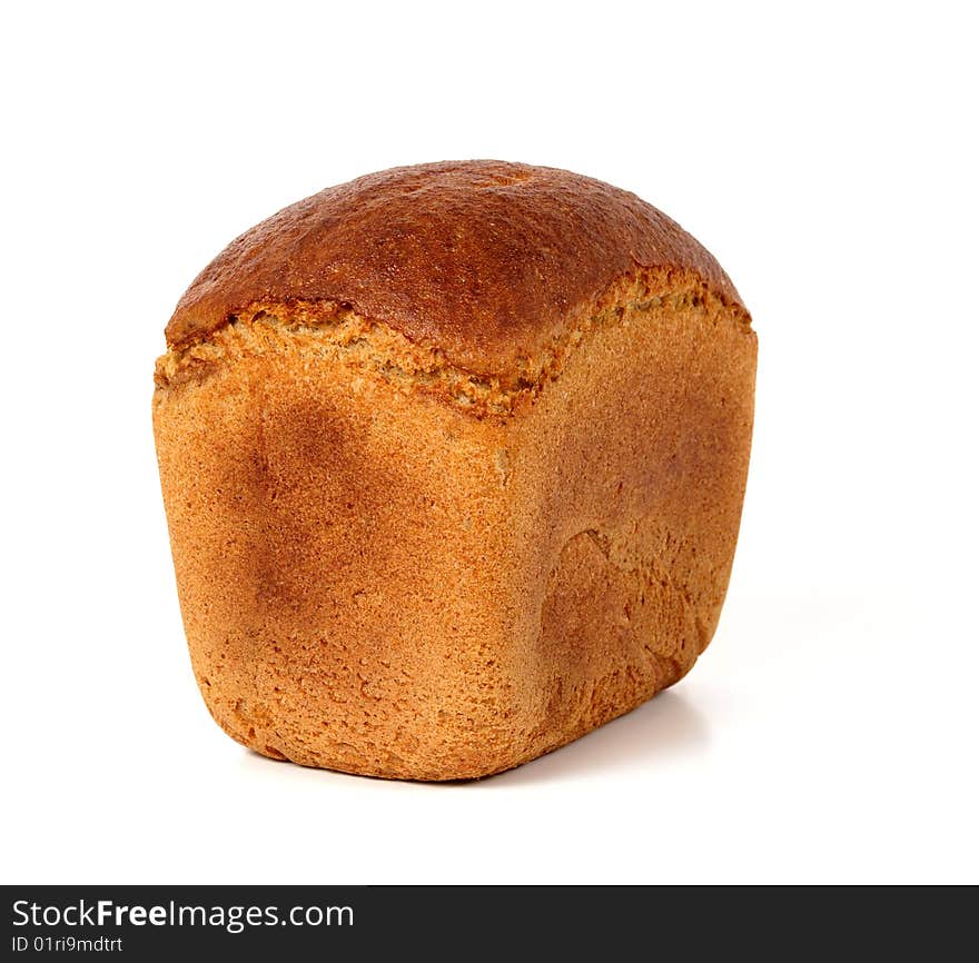 Loaf of rye bread.When sliced the inside of the loaf is of brown colour. Loaf of rye bread.When sliced the inside of the loaf is of brown colour.