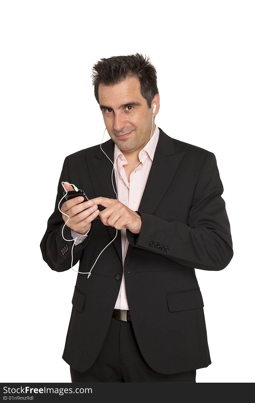 Businessman in suit that hears music from mp3 player. Businessman in suit that hears music from mp3 player