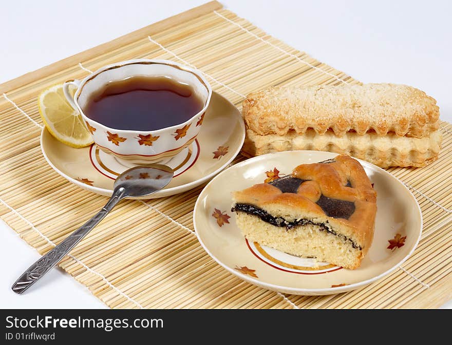 This picture depicts served morning tea with lemon and delicios pastry. This picture depicts served morning tea with lemon and delicios pastry.