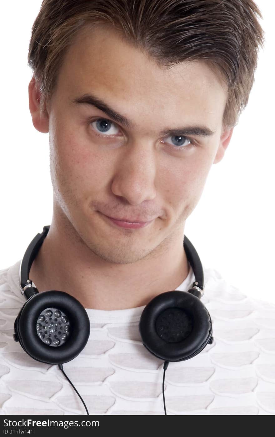 Portrait of young man wearing headphones   against white background. Portrait of young man wearing headphones   against white background